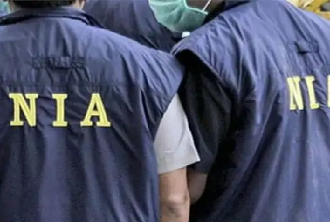 “NIA logo and officers conducting counter-terrorism investigations in India.”